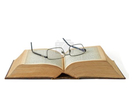 Photo for Old, book or glasses with manuscript of knowledge, ancient literature or history on a white studio background. Closeup of historic novel or spectacles for vintage scripture or reading on mockup space. - Royalty Free Image