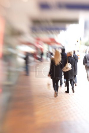 Photo for Blur, city and people are walking outdoor, town square for travel or commute with back view. Motion, moving and journey in urban New York street, adventure and day trip in metro with busy sidewalk. - Royalty Free Image