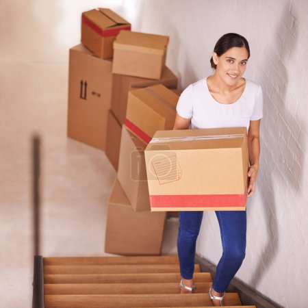 Portrait, smile and woman with boxes for moving, real estate and new home by stairs. Happy person, cardboard and relocation to property at steps in house, apartment and loan for mortgage of owner.