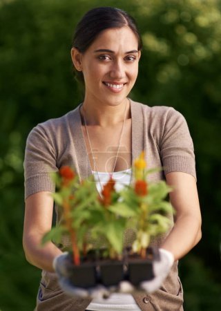 Photo for Nature, gardening and portrait of woman with flower plant in backyard for agriculture, botany and landscaping in nursery Environment, face and female person for ecology, growth and sustainability - Royalty Free Image