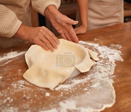 Photo for Hands, flour and people baking in kitchen of home together closeup with ingredients for recipe. Cooking, food or dough with chef and baker in apartment for fresh pastry preparation from above. - Royalty Free Image