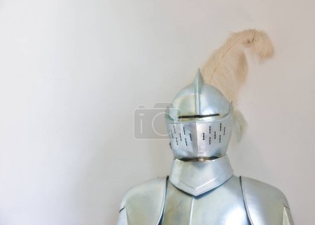 Photo for Knight, medieval suit and armor with mockup space of soldier, statue or honor on a gray studio background. Helmet, gear or equipment for battle, war or security in justice, shining silver or visor. - Royalty Free Image