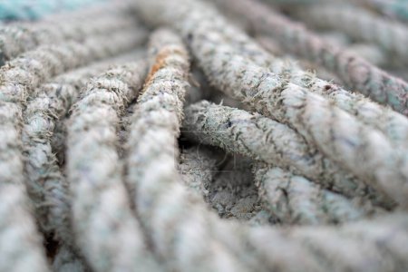 Macro, boat rope and textile with texture, nautical equipment for navigation and rigging with bundle of material. Weave, grunge or distressed cable for fishing or sailing, wool and pattern with gear.