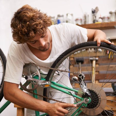Photo for Handyman, fixing and bicycles with with tools at workshop for repair, maintenance with small business. Mechanic, Entrepreneur and garage as expert for bike with equipment for service and upgrade. - Royalty Free Image