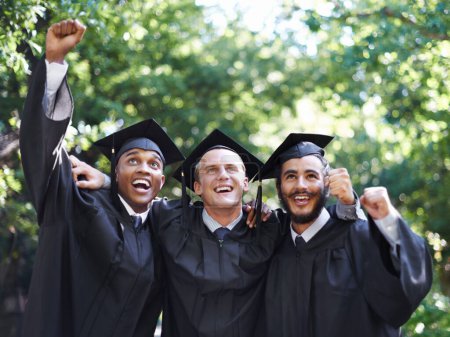 Photo for Happy, students and portrait at graduation with success, celebration and graduate outdoor with a smile. Fist pump, men and win at education event on campus with diversity and college achievement. - Royalty Free Image