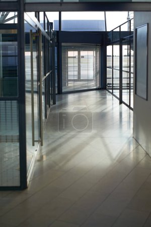Photo for Office, interior and hallway with glass windows in passage or corridor of modern workplace. Empty corporate building, structure or clean floor with walls of business architecture or industrial design. - Royalty Free Image