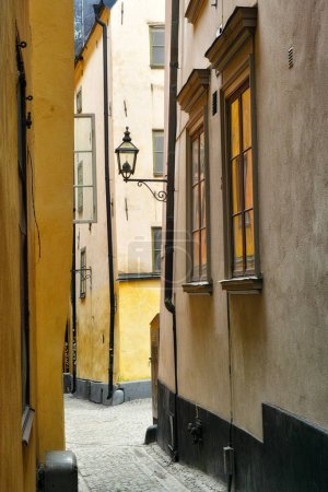 Photo for Travel, buildings and alley in ancient town with history, culture or holiday destination in Sweden. Vacation, old architecture and antique stone street in Stockholm with cobble path in vintage city. - Royalty Free Image