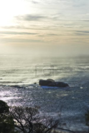 Photo for Nature, horizon and rocks by ocean in South Africa for travel destination, holiday and vacation. Natural background, landscape and waves, sky and water for scenic view, environment and ecosystem. - Royalty Free Image