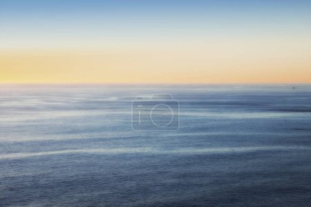 Photo for Ocean, sunset and horizon or water environment for tropical holiday on paradise island for summer, location or outdoor. Sea, calm and evening sky in Hawaii for travel destination, weekend or vacation. - Royalty Free Image