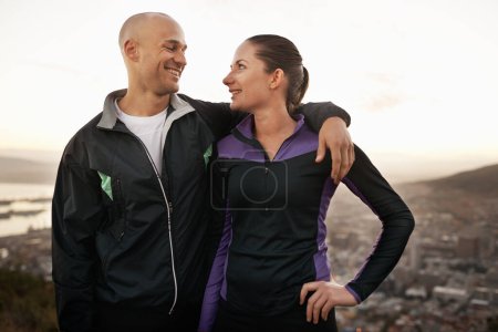 Photo for Happy couple, fitness and mountain with hug for workout, exercise or outdoor training together. Young man and woman with smile, love or support for hiking, running or health and wellness in nature. - Royalty Free Image