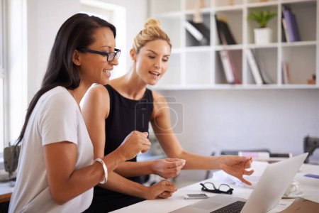 Photo for Women, planning and teamwork on laptop for graphic design ideas, brainstorming and advice or feedback in office. Professional designer or business people talking, reading and happy on a computer. - Royalty Free Image