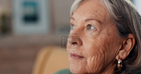 Photo for Thinking, depression and regret by old woman, home and retirement while feeling lonely. Remember, mental health and nostalgia by senior female person in closeup, mourning and alone with memories. - Royalty Free Image