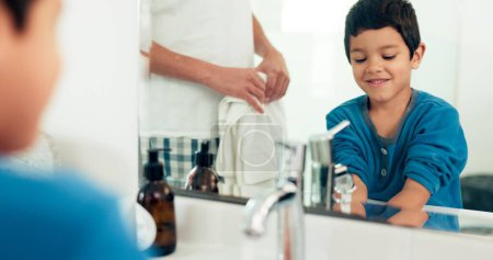 Photo for Family, cleaning and boy with hands in sink in bathroom with father and skincare for hygiene at home together. Love, smile and dad with happy child with water, liquid and soap for washing and health. - Royalty Free Image