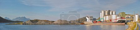 Photo for Industrial, landscape and ship on the ocean for transportation, factory and manufacturing. Panoramic view, boat or yacht for production with industry and natural background with nautical vessel. - Royalty Free Image