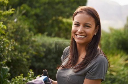 Photo for Woman, smile and portrait in a garden for plant pruning, sprout or checking leaf growth outdoor. Backyard, sustainability or face of happy female person gardening in spring with fresh air or sunshine. - Royalty Free Image