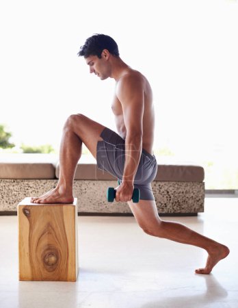 Photo for Fitness, box and dumbbell with body of man in home for workout or strong physical activity. Exercise, shirtless and lunges with confident young person training at apartment for health or wellness. - Royalty Free Image