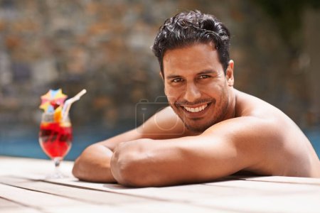 Photo for Man, relax and portrait at swimming pool with cocktail at hotel, resort and travel on luxury vacation. Summer, holiday and glass of alcohol to drink with happiness on deck at poolside in Mexico. - Royalty Free Image