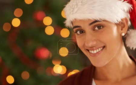 Photo for Woman, Christmas tree and portrait with santa hat, happy and pride for festive fashion in home living room. Girl, person and excited for xmas celebration by lights, ornaments or smile in house party. - Royalty Free Image