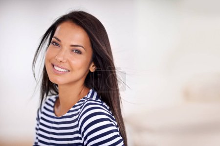 Photo for Woman, portrait and happy in home on weekend, smile and satisfaction in living room for enjoyment. Female person, breeze and confident on mockup space, cheerful and wellness by peace or calm mindset. - Royalty Free Image