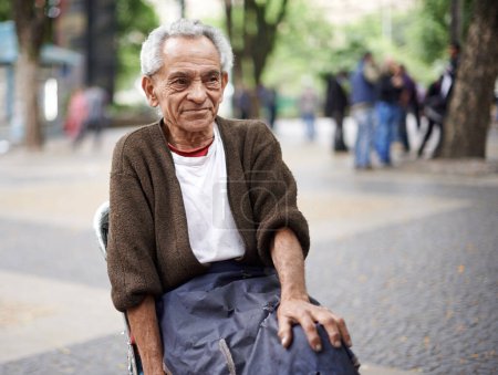 Photo for Relax, thinking or old man in a chair or city for peace in retirement, neighborhood or Sao Paulo. Outdoor, resting and poor elderly male person in street with poverty, hardship and wisdom in Brazil. - Royalty Free Image