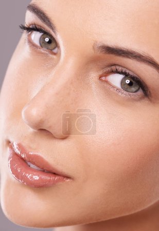 Photo for Portrait, beauty and woman with skincare, cosmetics and shine on a grey studio background. Face, person and model with glow and grooming with healthy skin and wellness with makeup and dermatology. - Royalty Free Image