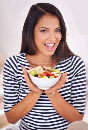 Photo for Portrait, woman and fruit bowl with smile, natural nutrition and healthy organic food. Happy, female person with snack with vitamins for skin and body wellness, balance diet and excited vegan choice. - Royalty Free Image