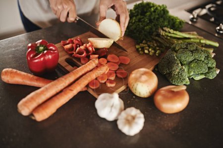 Photo for Kitchen, hands and knife with vegetables, chopping board and food with ingredients and diet plan. Closeup, utensils or chef with salad or lunch with person and healthy meal with dinner, vegan or home. - Royalty Free Image