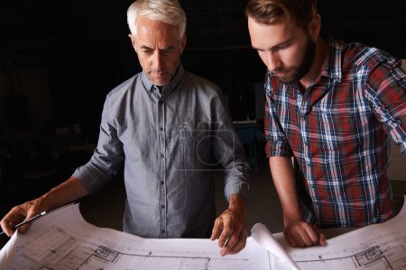 Photo for Engineering, collaboration and men with architecture blueprint in office for building, construction or repairs. Team, design and industrial apprentice plan and working on industry project with mentor. - Royalty Free Image