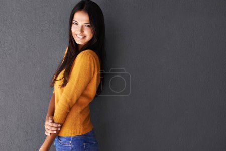Photo for Mockup space, fashion and female model in studio, portrait and cool or trendy style in gray background. Woman, smile and happy with confidence or pride, stylish or edgy in casual outfit or clothes. - Royalty Free Image
