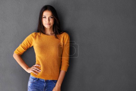 Photo for Portrait, fashion and woman in studio, edgy and cool or trendy style in gray background. Female model, proud and confidence or pride in mockup space, standing and stylish in casual outfit or clothes. - Royalty Free Image