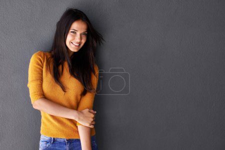 Photo for Portrait, female model and sweater in studio, fashion or cool style in gray background. Woman, smile and happy with confidence or pride in mockup space, stylish and edgy in casual outfit or clothes. - Royalty Free Image