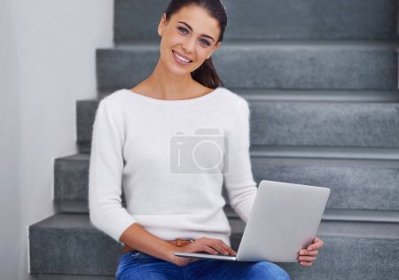 Photo for Laptop, portrait and happy woman on stairs in home for remote work, social media or email on internet in Australia. Computer, freelancer and smile of person on steps with technology to relax in house. - Royalty Free Image