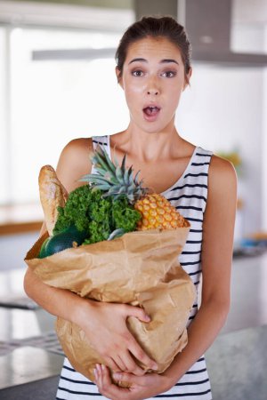 Photo for Home, surprise or portrait of woman with groceries on promotion, sale or discounts deal on nutrition. Wow, news offer or shocked person buying healthy food for cooking organic fruits or diet choice. - Royalty Free Image