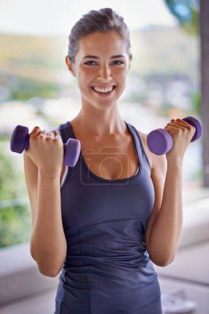 Photo for Portrait, fitness and dumbbells with smile of woman at gym for health, wellness or workout. Exercise, weight training and happy young person satisfied with performance, progress or strong muscles. - Royalty Free Image