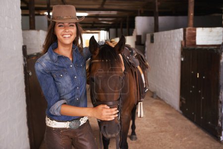 Photo for Woman or cowgirl, portrait and horse in stable to train or feed and grooming for animal or pet care. Person, stallion and barn to ride together in countryside in Texas for rural life and adventure - Royalty Free Image