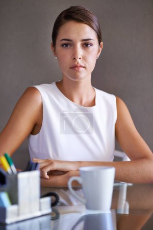 Photo for Portrait, business woman and confident at office desk, arms crossed and ambition in corporate career. Young hr administrator, face and relax in workplace by coffee, stationery and commitment in job. - Royalty Free Image