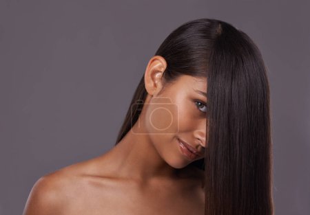 Photo for Portrait, straight hair and beauty of woman in makeup for skincare isolated on a gray studio background. Hairstyle, face and Indian model in cosmetics at salon for treatment or care at hairdresser. - Royalty Free Image