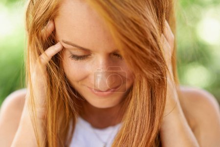 Photo for Beauty, hair and redhead woman outdoor in nature for travel, vacation or holiday in summer. Hairstyle, shy and young person at park in the countryside or garden with natural skin on happy face. - Royalty Free Image