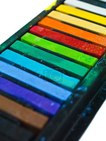 Photo for Paint, pastel and artist chalk in studio for rainbow or vibrant creativity, texture and pigments for fine or visual arts. Oil or watercolor sticks, color or palette to shade or blend with composition. - Royalty Free Image