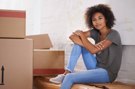 Photo for Moving, woman and portrait with new home, box and package for real estate property and courier parcel. Cardboard, delivery and African female person with packing in a house with a relax homeowner. - Royalty Free Image
