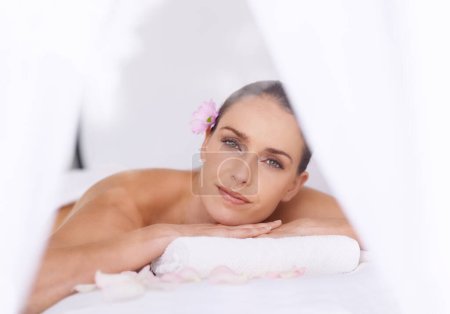 Photo for Relax, massage and portrait of woman at hotel spa for health, wellness and luxury holistic treatment. Self care, peace and calm girl on table for muscle therapy, comfort and zen body pamper service. - Royalty Free Image