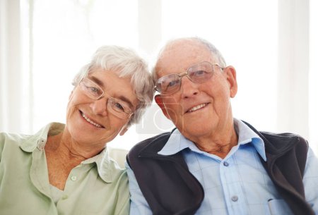 Photo for Old couple, portrait and smile in home in retirement for bonding connection for weekend, holiday or love. Senior Man, woman and face with glasses in apartment for marriage commitment, caring or rest. - Royalty Free Image