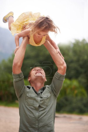 Photo for Father, child and lifting outdoor for play together in nature on holiday vacation for love connection, game or adventure. Male person, daughter and happiness in Australia for bonding, fun or travel. - Royalty Free Image