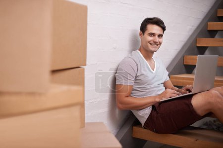 Photo for Portrait, boxes and man with laptop in home for property investment, real estate or mortgage of new apartment. Homeowner, computer and face of happy male person for relocation, growth or renovation. - Royalty Free Image