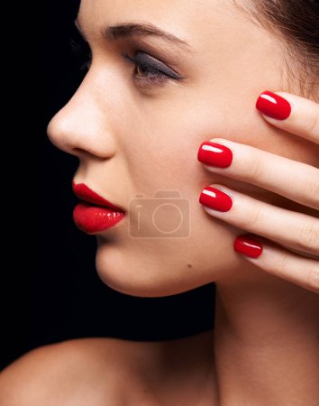 Photo for Makeup, manicure and young woman in studio with trendy, beauty and face routine with red lips. Cosmetics, nail polish and profile of female model with facial cosmetology treatment by black background. - Royalty Free Image