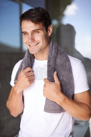 Photo for Happy man, towel and hygiene with satisfaction for grooming or morning freshness by window at home. Handsome, young male person with smile for cleanliness, masculine or health and wellness at house. - Royalty Free Image