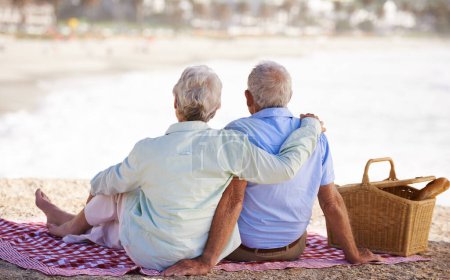 Photo for Elderly, couple and relax beach for picnic together for summer bonding or travel connection, outdoor or view. Old woman, man and back for vacation holiday at ocean in Hawaii for rest, peace or fun. - Royalty Free Image