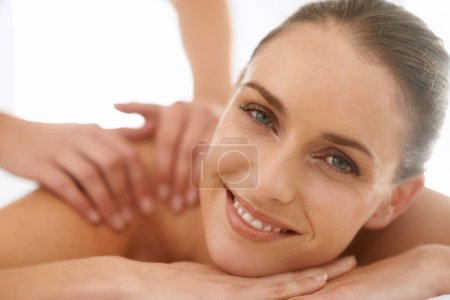 Photo for Woman, portrait and smile for massage or hands for spa treatment stress relief at resort, physical therapy or peace. Female person, face and relax service in Hawaii for skincare, vacation or comfort. - Royalty Free Image