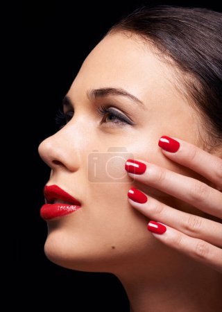Photo for Cosmetics, manicure and face of woman in studio with trendy, beauty and facial routine with red lips. Makeup, nail polish and female model with cosmetology treatment by dark black background - Royalty Free Image