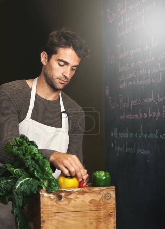 Photo for Chef, basket and business owner with vegetables or groceries in a bag for cooking or diet in kitchen. Man packing, shopkeeper and person sorting healthy food dinner or packaging box of ingredients. - Royalty Free Image